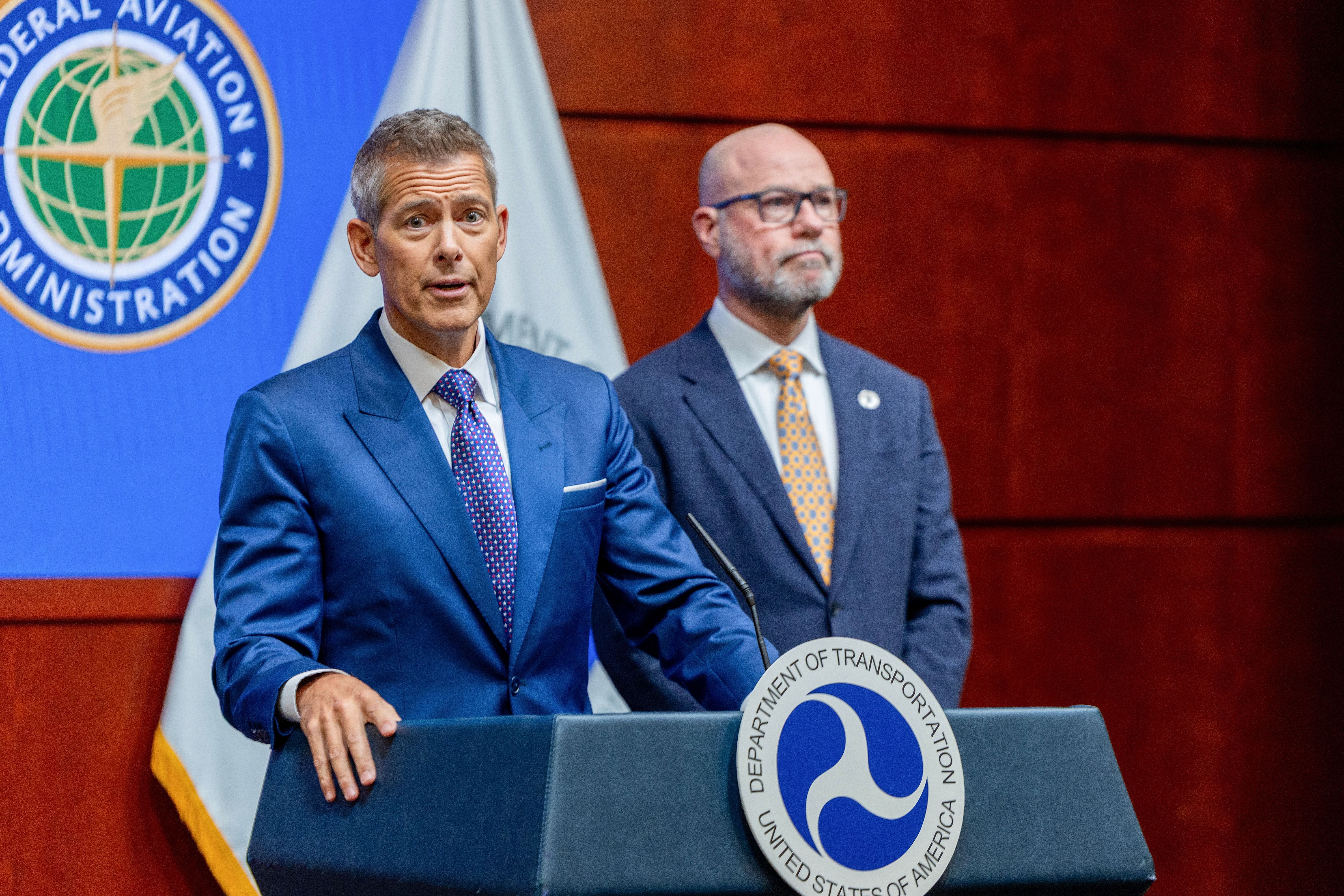 U.S. Transportation Secretary Sean P. Duffy (left) and FAA Administrator Bryan Bedford announced Wednesday that the FAA will reduce air traffic at many busy airports to maintain safety during the government shutdown, which has led to staffing shortages of air traffic controllers.